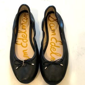 Black leather ballet flats